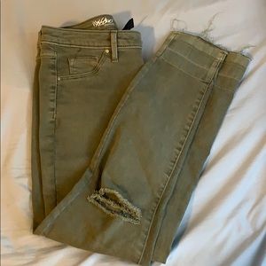 Army green mid rise jeans with holes on knees